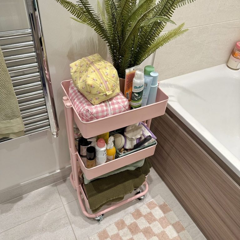 Pink storage trolley in a bathroom