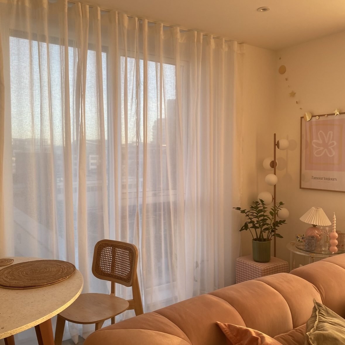 Image of sheer track curtains in a apartment living room.