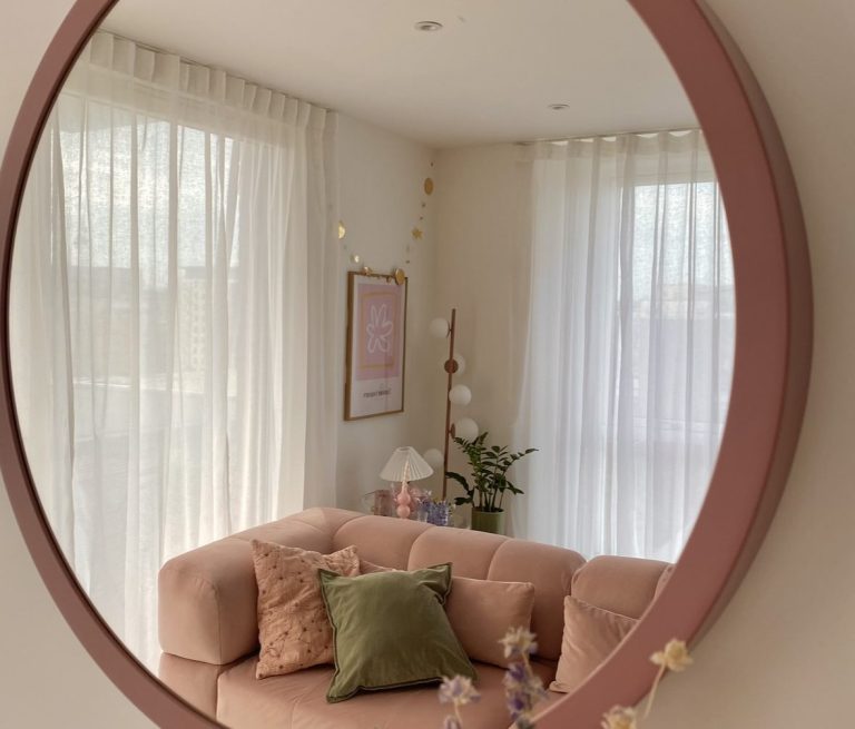 Pink living room with white sheer curtains