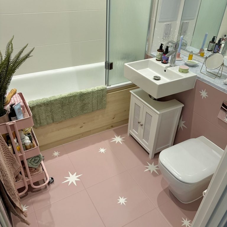 Small bathroom with pink star tiles.